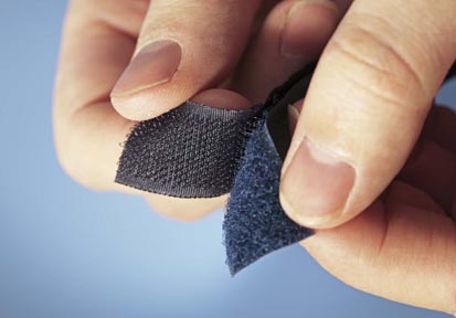 image of velcro hook and loop being pulled apart by hand