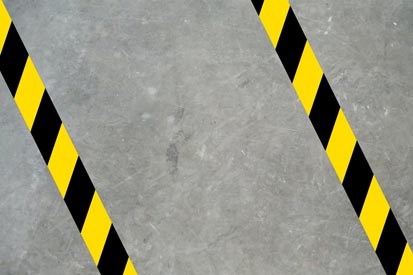 image showing hazard marking tape applied to concrete floor